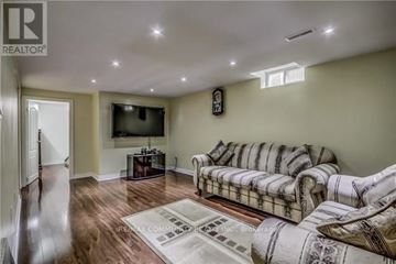 Markham (Milliken Mills East) apartment for rent - A living room with a couch and a television.