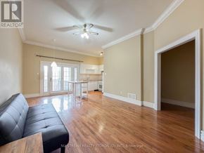 Richmond Hill (Oak Ridges Lake Wilcox) apartment for rent - A bedroom with a bed, a couch, and a window.