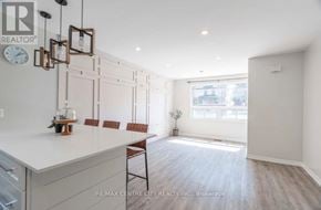 London South (South E) apartment for rent - A kitchen with a white countertop and brown chairs.