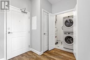 Russell multi-family for rent - A laundry room with a washer and dryer in it.
