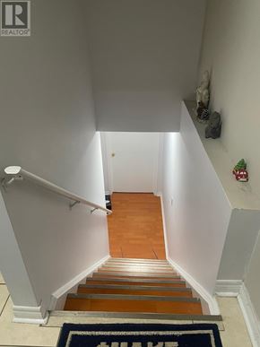 Markham (Cedarwood) apartment for rent - A staircase with a carpet that says "Welcome Home" on it.