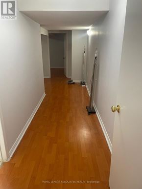 Markham (Cedarwood) apartment for rent - A hallway with a wooden floor and white walls.