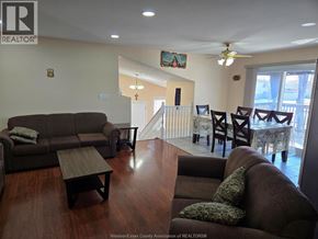 Windsor apartment for rent - A living room with a couch, chairs, and a coffee table.
