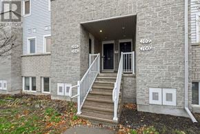 North Grenville townhouse for rent - The image shows the front of a building with the number 102 on it.
