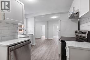 Windsor multi-family for rent - A kitchen with a stainless steel dishwasher and a white countertop.