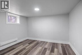 Windsor multi-family for rent - A room with wooden flooring and a window.