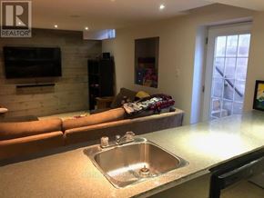Aurora (Aurora Village) apartment for rent - A kitchen with a sink and a couch.