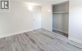 Niagara Falls condo for rent - A room with a white door and a glass window.