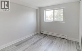 Niagara Falls condo for rent - A room with a window and a radiator on the floor.