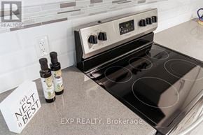 Niagara Falls (Stamford) multi-family for rent - A stove top oven with a note that says nest best on the counter.