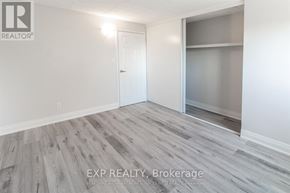 Niagara Falls (Stamford) multi-family for rent - A room with a white door and a glass window with a wooden floor.
