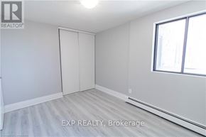 Niagara Falls (Downtown) apartment for rent - A room with a window and a sliding door.