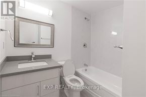 Niagara Falls (Downtown) apartment for rent - A bathroom with a toilet, sink, and bathtub.