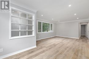 Whitby (Downtown Whitby) apartment for rent - A spacious room with a large window and wooden flooring.