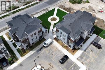 Cambridge townhouse for rent - A bird's eye view of a residential area with houses and cars.