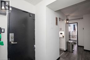 Kitchener condo for rent - A black door with a silver handle is on the left side of the image.