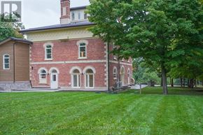 Oro-Medonte (Hawkestone) multi-family for rent - A red brick building with a white door and windows.