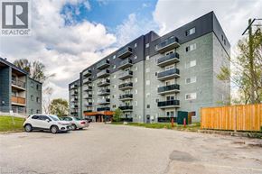London apartment for rent - A snowy landscape with apartment buildings and bare trees.
