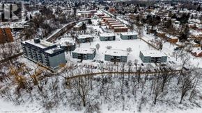 London apartment for rent - A snowy landscape with a building and trees in the foreground.