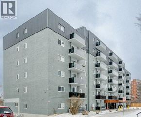 London apartment for rent - A large grey building with a balcony on the second floor.