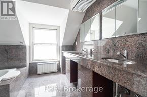 Toronto (Forest Hill South) fourplex for rent - A bedroom with a bed, a couch, and a rug.