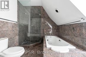 Toronto (Forest Hill South) fourplex for rent - A bathroom with a large mirror and a window.
