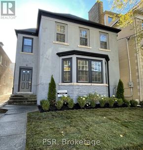 Toronto (Forest Hill South) fourplex for rent - A kitchen with white cabinets and a marble countertop.