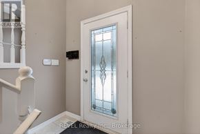 Niagara Falls (Oldfield) apartment for rent - A white door with a glass panel and a diamond pattern in the middle.