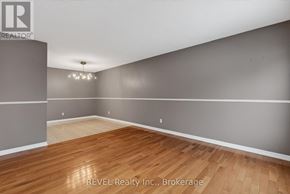 Niagara Falls (Oldfield) apartment for rent - A room with wooden flooring and a chandelier.