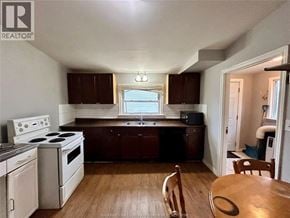 Windsor apartment for rent - A kitchen with wooden floors and white appliances.