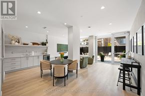 Ottawa apartment for rent - A modern building with a sign that reads "Royal LePage Team REALTY, Brookeage" in front of it.