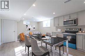 Hamilton (Huntington) apartment for rent - A modern kitchen with a dining table set for two.