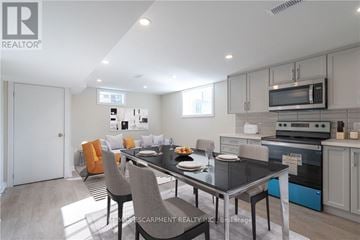 Hamilton (Huntington) apartment for rent - A modern kitchen with a dining table set for two.