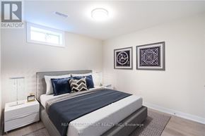 Hamilton (Huntington) apartment for rent - A bedroom with a large bed, two pillows, and two wall art pieces.