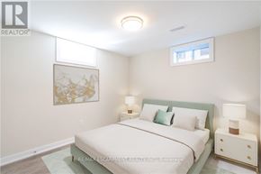 Hamilton (Huntington) apartment for rent - A bedroom with a bed, nightstands, and a framed picture on the wall.