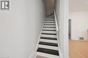 Guelph apartment for rent - A staircase with black and white steps.