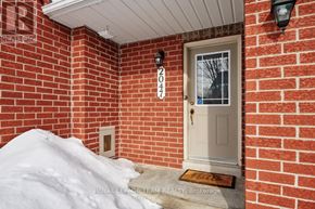 Ottawa townhouse for rent - A snow-covered front porch with a door and a doormat.