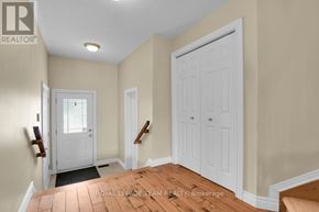 Ottawa townhouse for rent - A room with a white door and a wooden floor.