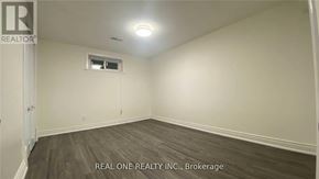 Markham (Royal Orchard) apartment for rent - A room with a window and a door, with the text "REAL ONE REALTY INC., Brokerage" on the bottom.