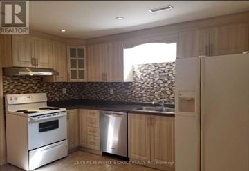 Mississauga (East Credit) apartment for rent - A kitchen with a stove top oven and a dishwasher.