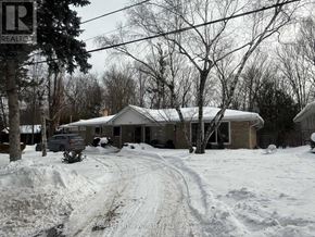 Toronto (Bayview Village) apartment for rent - A house with a car parked in front of it.