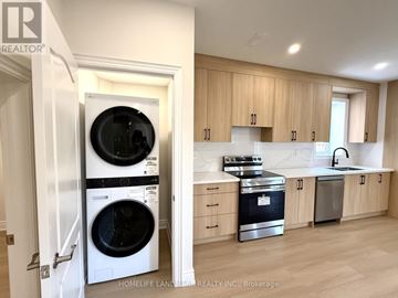 Newmarket (Glenway Estates) apartment for rent - A modern kitchen with wooden cabinets and a stainless steel dishwasher and oven.