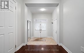 Oakville (Bc Bronte Creek) townhouse for rent - A hallway with a door on the left and a door on the right.