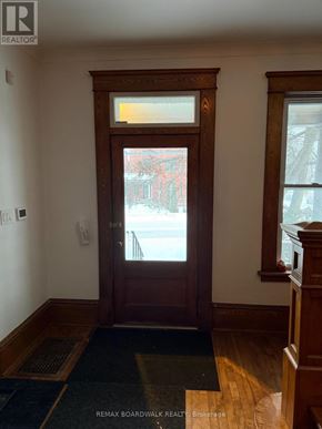 Carleton Place apartment for rent - A brown door with a window above it.