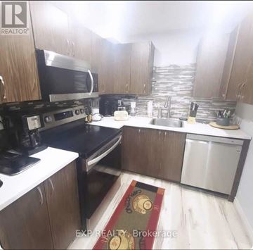 Welland (Lincoln/Crowland) apartment for rent - A kitchen with wooden cabinets and stainless steel appliances.