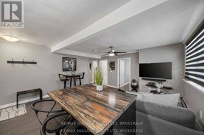 Niagara Falls (Downtown) multi-family for rent - A well-lit room with a wooden table and chairs.