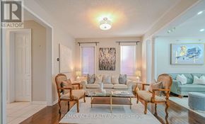 Brampton (Fletcher's West) apartment for rent - A living room with a couch, chairs, and a coffee table.