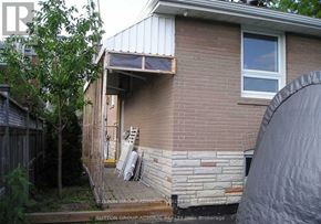 Toronto (Dorset Park) apartment for rent - A house with a brick wall and a window.