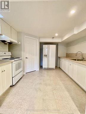 Richmond Hill (Doncrest) apartment for rent - A kitchen with white appliances and cabinets.