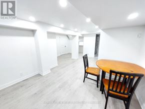 Clarington (Bowmanville) apartment for rent - A room with a table and chairs in it.